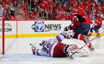 WASHINGTON - APRIL 28:  Viktor Kozlov #25 of the Washington Capitals takes a shot on goal against Henrik Lundqvist #30 of the New York Rangers during Game Seven of the Eastern Conference Quarterfinal Round of the 2009 Stanley Cup Playoffs on April 28, 200