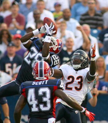 ORCHARD PARK, NY - AUGUST 15: Leodis McKelvin #28 of the Buffalo Bills intercepts a pass from Jay Cutler (not shown) intended for Devin Hester # 23 of the Chicago Bears on August 15, 2009 at Ralph Wilson Stadium in Orchard Park, New York. Bryan Scott #43 
