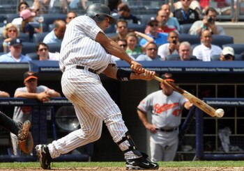 NEW YORK - JULY 22:  Jorge Posada #20 of the New York Yankees breaks his bat against the Baltimore Orioles on July 22, 2009 at Yankee Stadium in the Bronx borough of New York City.  (Photo by Jim McIsaac/Getty Images)