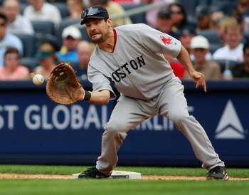 NEW YORK - AUGUST 08:  Casey Kotchman #11 of the Boston Red Sox catches a ball at first base during the game on August 8, 2009 at Yankee Stadium in the Bronx borough of New York City.  (Photo by Jared Wickerham/Getty Images)