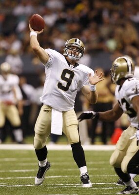 NEW ORLEANS - AUGUST 14:  Quarterback Drew Brees #9 of the New Orleans Saints throws a touchdown pass to tight end Jeremy Shockey (not pictured) during a preseason game against the Cincinnati Bengals on August 14, 2009 at the Superdome in New Orleans, Lou