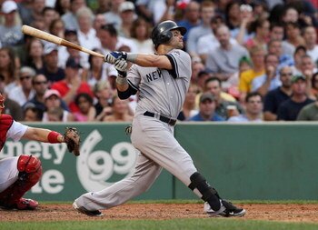BOSTON - AUGUST 22:  Nick Swisher #33 of the New York Yankees hits a home run in the seventh inning against the Boston Red Sox at Fenway Park on August 22, 2009 in Boston, Massachusetts. (Photo by Jim Rogash/Getty Images)