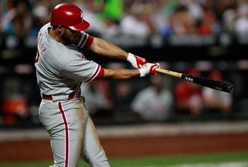 NEW YORK - AUGUST 22:  Pedro Feliz #7 of the Philadelphia Phillies hits an RBI against the New York Mets during the game on August 22, 2009 at Citi Field in the Flushing neighborhood of the Queens borough of New York City.  (Photo by Jared Wickerham/Getty