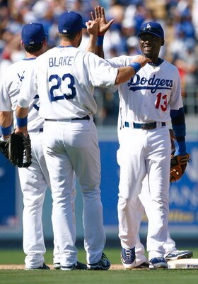 LOS ANGELES, CA - AUGUST 22:  Orlando Hudson (R) #13 of the Los Angeles Dodgers receives a high five from Casey Blake #23 following the Dodgers' victory over the Chicago Cubs at Dodger Stadium on August 22, 2009 in Los Angeles, California. The Dodgers def