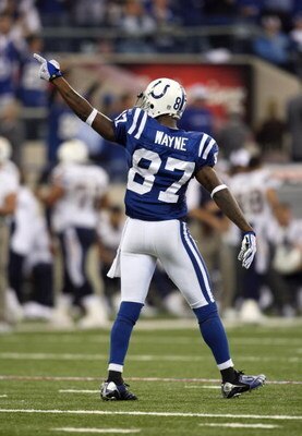 INDIANAPOLIS - JANUARY 13:  Reggie Wayne #87 of the Indianapolis Colts gestures towards the fans as he walks on the field against the San Diego Chargers during their AFC Divisional Playoff game at the RCA Dome on January 13, 2008 in Indianapolis, Indiana.