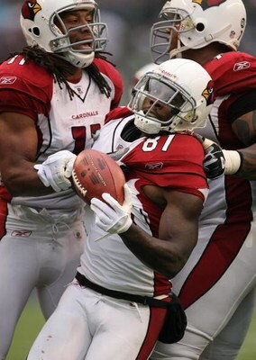 SEATTLE - NOVEMBER 16:  Wide receiver Anquan Boldin #81 of the Arizona Cardinals celebrates after recovering a fumble by Larry Fitzgerald #11 (left) against the Seattle Seahawks on November 16, 2008 at Qwest Field in Seattle, Washington. The Cardinals def