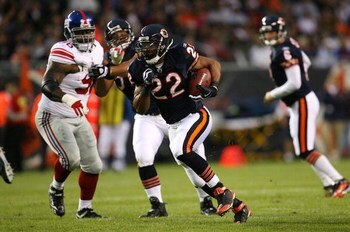CHICAGO - AUGUST 22: Matt Forte #22 of the Chicago Bears runs for a 32-yard touchdown in the first quarter against the New York Giants during their preseason NFL game at Soldier Field on August 22, 2009 in Chicago, Illinois.  (Photo by Jonathan Daniel/Get