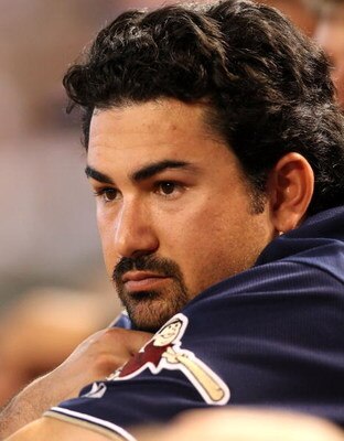 PHOENIX - JULY 08:  Adrian Gonzalez #23 of the San Diego Padres watches from the dugout during the major league baseball game against the Arizona Diamondbacks at Chase Field on July 8, 2009 in Phoenix, Arizona. The Diamondbacks defeated the Padres 6-2.  (
