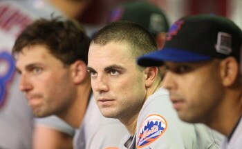 PHOENIX - AUGUST 10: (L-R) Jeff Francoeur #12, David Wright #5 and Alex Cora #3 of the New York Mets look on from the dugout during the game against the Arizona Diamondbacks at Chase Field on August 10, 2009 in Phoenix, Arizona. (Photo by Christian Peters
