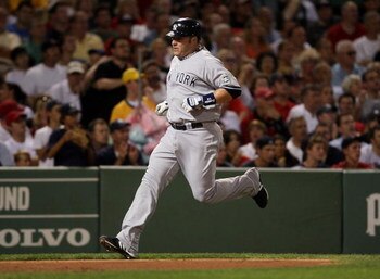 BOSTON - AUGUST 21:  Eric Hinske #14 of the New York Yankees scores a run in the second inning against the Boston Red Sox at Fenway Park on August 21, 2009 in Boston, Massachusetts. (Photo by Jim Rogash/Getty Images)