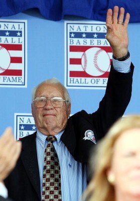 COOPERSTOWN, NY - JULY 26:  Hall of Famer Bob Feller waves to the crowd as he is introduced at Clark Sports Center during the 2009  Baseball Hall of Fame induction ceremony on July 26, 2009 in Cooperstown, New York.  (Photo by Jim McIsaac/Getty Images)