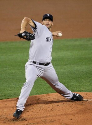 BOSTON - AUGUST 21:  Andy Pettitte #46  of the New York Yankees throws against the Boston Red Sox at Fenway Park on August 21, 2009 in Boston, Massachusetts. (Photo by Jim Rogash/Getty Images)