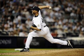 NEW YORK - AUGUST 07:  Mariano Rivera #42 of the New York Yankees delivers a pitch against the Boston Red Sox in the ninth inning on August 7, 2009 at Yankee Stadium in the Bronx borough of New York City.  (Photo by Jeff Zelevansky/Getty Images)