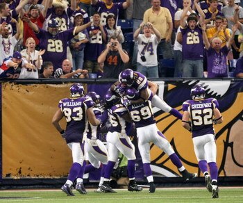 MINNEAPOLIS - SEPTEMBER 21:  Cornerback Antoine Winfield #28 of the Minnesota Vikings celebrates with the defensive unit after scoring a touchdown following his sack and fumble recovery against the Carolina Panthers at the HH Humphrey Metrodome on Septemb