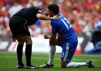 LONDON, ENGLAND - AUGUST 09:  Referee Chris Foy checks on Michael Ballack of Chelsea during the FA Community Shield match between Manchester United and Chelsea at Wembley Stadium on August 9, 2009 in London, England.  (Photo by Jamie McDonald/Getty Images