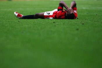 LONDON, ENGLAND - AUGUST 09:  Patrice Evra of Manchester United holds his face during the FA Community Shield match between Manchester United and Chelsea at Wembley Stadium on August 9, 2009 in London, England.  (Photo by Jamie McDonald/Getty Images)