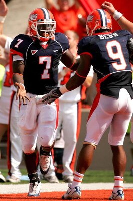 CHAMPAIGN, IL - OCTOBER 06:  Juice Williams #7 of the Illinois Fighting Illini celebrates scoring a touchdown with teammate Arrelious Benn #9 against the Wisconsin Badgers October 6, 2007 at Memorial Stadium in Champaign, Illinois.  (Photo by Matthew Stoc