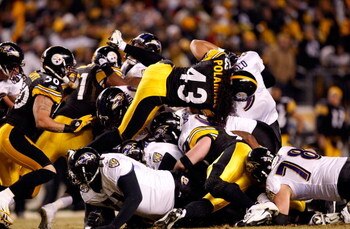 PITTSBURGH - JANUARY 18:  Troy Polamalu #43 of the Pittsburgh Steelers and the Steeler defense stop quarterback Joe Flacco #5 of the Baltimore Ravens on a 4th and 1 play during the AFC Championship game on January 18, 2009 at Heinz Field in Pittsburgh, Pe