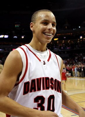 CHARLOTTE, NC - DECEMBER 06:  Stephen Curry #30 of the Davidson Wildcats reacts to his team's 72-67 victory over the North Carolina State Wolfpack during their game at Time Warner Cable Arena on December 6, 2008 in Charlotte, North Carolina.  (Photo by St