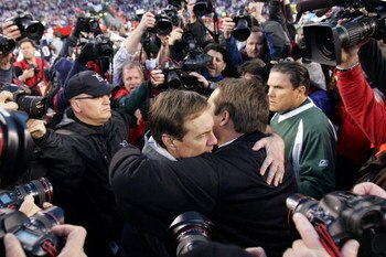FOXBORO, MA - JANUARY 07:  Head coach Eric Mangini (R) of the New York Jets hugs head coach Bill Belichick of  the New England Patriots after their AFC Wild Card Playoff Game at Gillette Stadium on January 7, 2007 in Foxboro, Massachusetts. The Patriots w