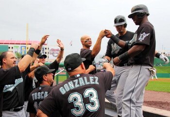 WASHINGTON - AUGUST 6:  Shortstop Hanley Ramirez #2 of the Florida Marlins is congratulated by teammates after scoring a run in the first inning against the Washington Nationals during their MLB game on August 6, 2009 at Nationals Park in Washington, DC. 