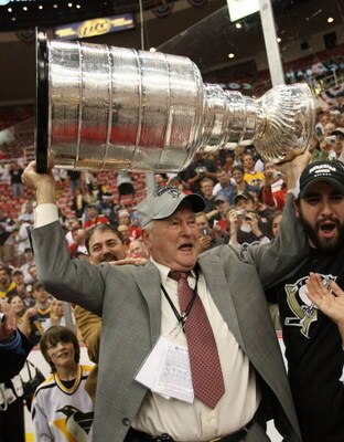 DETROIT - JUNE 12: Senior Advisor of Hockey Operations Ed Johnston of the Pittsburgh Penguins holds the Stanley Cup following the Penguins victory over the Detroit Red Wings in Game Seven of the 2009 NHL Stanley Cup Finals at Joe Louis Arena on June 12, 2