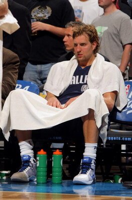 DENVER - MAY 13:  Dirk Nowitzki #41 of the Dallas Mavericks sits on the bench late in the game against  the Denver Nuggets in Game Five of the Western Conference Semifinals during the 2009 NBA Playoffs at Pepsi Center on May 13, 2009 in Denver, Colorado. 