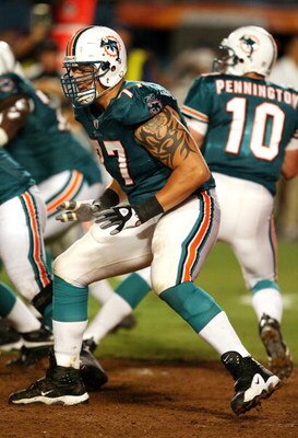 MIAMI - AUGUST 22:  Offensive lineman Jake Long #77 of the Miami Dolphins drops back to block against the Carolina Panthers during a pre-season game at Land Shark Stadium on August 22, 2009 in Miami, Florida. The Dolphins defeated the Panthers 27-17.  (Ph