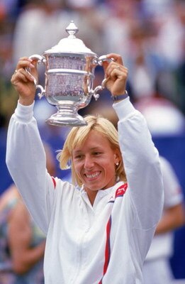 FLUSHING MEADOWS, NY - 1986:  Martina Navratilova hoists her trophy as she celebrates winning the Women's U.S. Open title in August of 1986 at Flushing Meadows in New York.   (Photo by Trevor Jones/Getty Images)