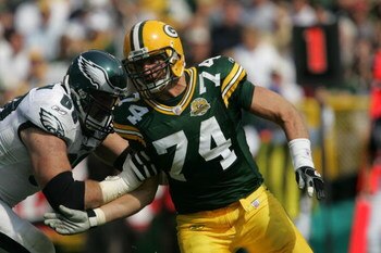GREEN BAY, WI - SEPTEMBER 09: Aaron Kampman #74 of the Green Bay Packers rushes against Jon Runyan #69 of the Philadelphia Eagles on September 9, 2007 at Lambeau Field in Green Bay, Wisconsin. The Packers defeated the Eagles 16-13. (Photo by Jonathan Dani
