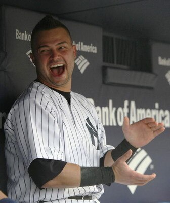 NEW YORK - JULY 2:  Nick Swisher #33 of the New York Yankees sits in the dugout before a game against the Seattle Mariners at Yankee Stadium on July 2, 2009 in the Bronx borough of New York City.  (Photo by Nick Laham/Getty Images)