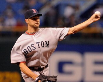 ST. PETERSBURG, FL - APRIL 30: Outfielder Jonathan Van Every #30  of the Boston Red Sox pitches against the Tampa Bay Rays April 30, 2009 at Tropicana Field in St. Petersburg, Florida.  (Photo by Al Messerschmidt/Getty Images)