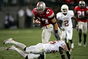 COLUMBUS, OH - SEPTEMBER 10: Linebacker A.J. Hawk #47 of the Ohio State Buckeyes avoids the tackle of wide receiver Mark McCoy #25 of the Texas Longhorns after a fumble recovery during the second quarter at Ohio Stadium on September 10, 2005 in Columbus,