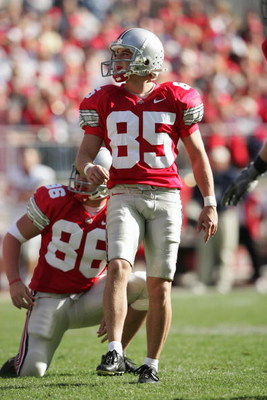 COLUMBUS, OH - OCTOBER 30: Mike Nugent #85 and Kyle Turano #86 of the Ohio State Buckeyes watch the flight of a field goal attempt during the game against the Penn State Nittany Lions at Ohio Stadium on October 30, 2004 in Columbus, Ohio. Ohio State defe