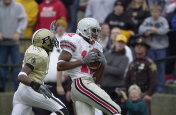 WEST LAFAYETTE, IN - NOVEMBER 9: Split end Michael Jenkins #12 of the Ohio State Buckeyes hauls in the game-winning touchdown pass in the fourth quarter over cornerback Antwaun Rogers #12 of the Purdue Boilermakers during the Big 10 Conference football g