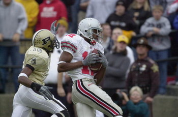 WEST LAFAYETTE, IN - NOVEMBER 9:  Split end Michael Jenkins #12 of the Ohio State Buckeyes hauls in the game-winning touchdown pass in the fourth quarter over cornerback Antwaun Rogers #12 of the Purdue Boilermakers during the Big 10 Conference football g