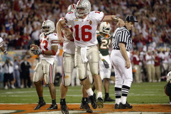 TEMPE, AZ - JANUARY 3: Quarterback Craig Krenzel #16 of the Ohio State Buckeyes celebrates after scoring the team's first touchdown against the University of Miami Hurricanes during the Tostitos Fiesta Bowl at Sun Devil Stadium on January 3, 2003 in Temp