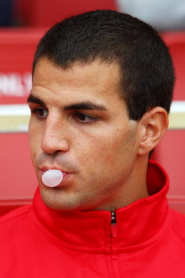 LONDON, ENGLAND - AUGUST 01:  Arsenal substitute Cesc Fabregas chews gum during the Emirates Cup match between Arsenal and Athletico Madrid at the Emirates Stadium on August 1, 2009 in London, England.  (Photo by Phil Cole/Getty Images)
