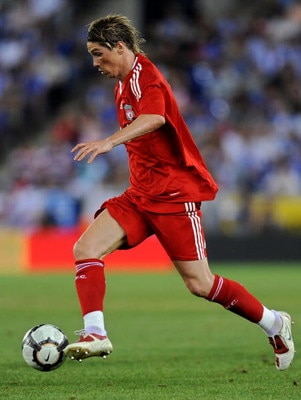 BARCELONA, SPAIN - AUGUST 02:  Fernando Torres of Liverpool runs with the ball during the pre-season friendly match between Espanyol and Liverpool at the Nuevo Estadio de Cornella-El Prat on August 2, 2009 in Barcelona, Spain. Liverpool lost the match 3-0