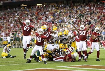 GLENDALE, AZ - AUGUST 28:  Runningback Jason Wright #31 of the Arizona Cardinals scores a 11 yard touchdown reception against the Green Bay Packers during the fourth quarter of the preseason NFL game at the Universtity of Phoenix Stadium on August 28, 200