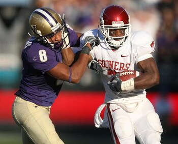 SEATTLE - SEPTEMBER 13:  Running back DeMarco Murray #7 of the Oklahoma Sooners rushes against Nate Williams #8 of the Washington Huskies on September 13, 2008 at Husky Stadium in Seattle Washington. (Photo by Otto Greule Jr/Getty Images)