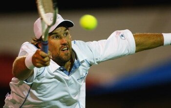ADELAIDE, AUSTRALIA - JANUARY 8:  Patrick Rafter of Australia in action in his  doubles match with Joshua Eagles against Mark Merklein of the Bahamas and Vincent Spadea of the USA in the AAPT Championships at Memorial Drive January 8, 2004 in Adelaide, Au