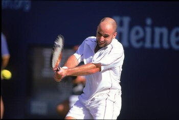31 Aug 2000: Andre Agassi of the US swings at the ball in a match against Arnaud Clement of France during the US Open at the USTA National Tennis Center in Flushing Meadows, New York.  Arnaud Clement defeated Andre Agassi (1)6-3, 6-2, 6-4..Mandatory Credi