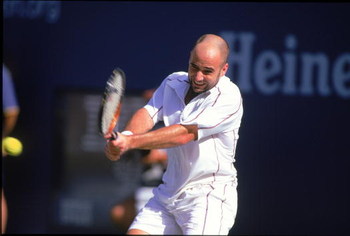 31 Aug 2000: Andre Agassi of the US swings at the ball in a match against Arnaud Clement of France during the US Open at the USTA National Tennis Center in Flushing Meadows, New York.  Arnaud Clement defeated Andre Agassi (1)6-3, 6-2, 6-4..Mandatory Credi