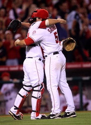 ANAHEIM, CA - MAY 09:  Pitcher Joe Saunders #51 and catcher Mike Napoli #44 of the Los Angeles Angels of Anaheim hug after getting the final out of Saunders' complete game shutout of the Kansas City Royals on May 9, 2009 at Angel Stadium in Anaheim, Calif