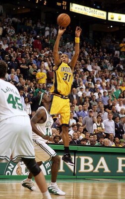 BOSTON - MAY 3:  Reggie Miller #31 of the Indiana Pacers scores a three point goal late in the game over Ricky Davis #12 of the Boston Celtics, Game five of the Eastern Conference Quarterfinals during the 2005 NBA Playoffs at Fleet Center on May 3, 2005 i