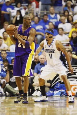 ORLANDO, FL - JUNE 14:  Kobe Bryant #24 of the Los Angeles Lakers looks to move the ball against Courtney Lee #11 of the Orlando Magic in Game Five of the 2009 NBA Finals on June 14, 2009 at Amway Arena in Orlando, Florida. The Lakers won 99-86.  NOTE TO 