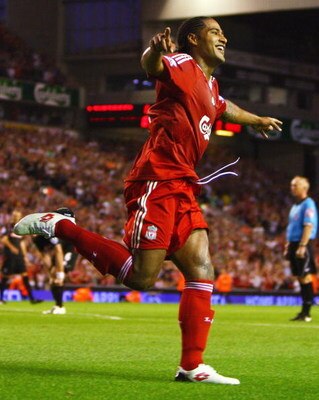 LIVERPOOL, ENGLAND - AUGUST 19:  Glen Johnson of Liverpool celebrates scoring his team's second goal during the Barclays Premier League match between Liverpool and Stoke City at Anfield on August 19, 2009 in Liverpool, England.  (Photo by Clive Brunskill/