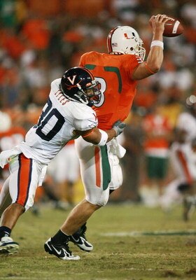 CORAL GABLES, FL - NOVEMBER 10:  Safety Nate Lyles #30 of the Virginia Cavaliers sacks quarterback Kyle Wright #3 of the Miami Hurricanes at the Orange Bowl November 10, 2007 in Coral Gables, Florida.  (Photo by Doug Benc/Getty Images)