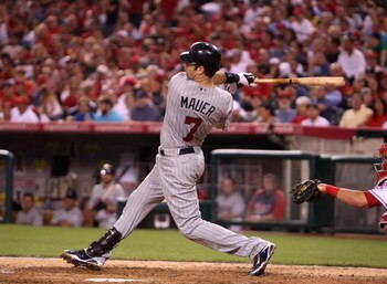 ANAHEIM, CA - JULY 24:  Joe Mauer #7 of the Minnesota Twins hits his second home run of the game in the sixth inning against the Los Angeles Angels of Anaheim on July 24, 2009 at Angel Stadium in Anaheim, California.  (Photo by Stephen Dunn/Getty Images)